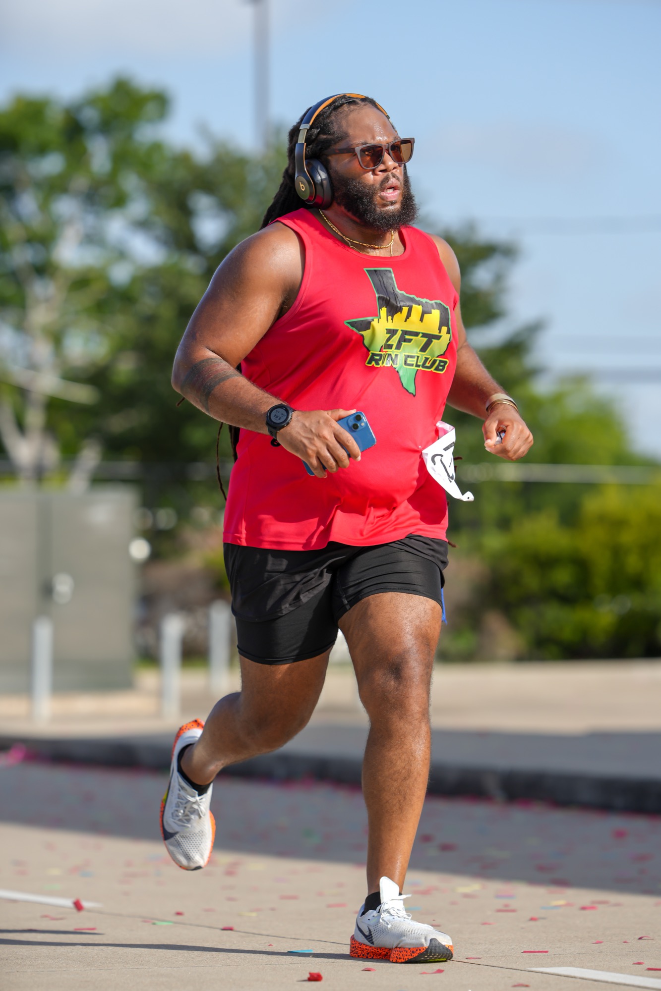 ZFT Houston Anniversary 5K — runner in red ZFT jersey